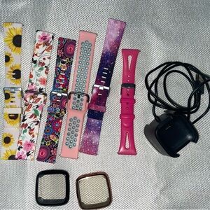 Lot of FitBit Versa 2 bands (6), case covers (7) and charger